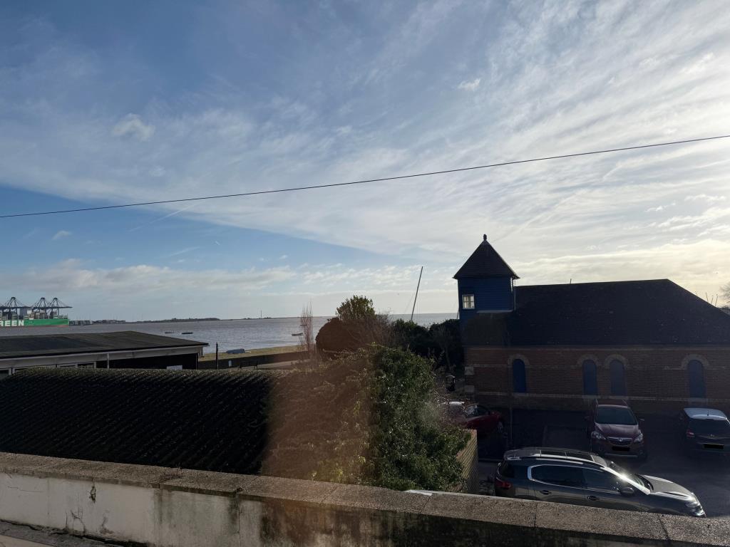 Lot: 41 - THREE-BEDROOM END-TERRACE COTTAGE FOR IMPROVEMENT - View from Bedroom three window toward the sea front